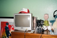 a tv on top of a dresser